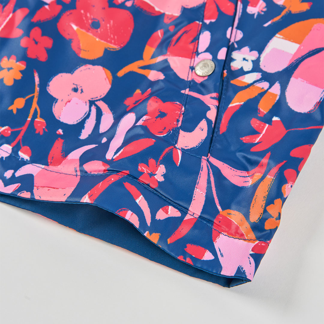Impermeable reversible azul marino flores mini niña
