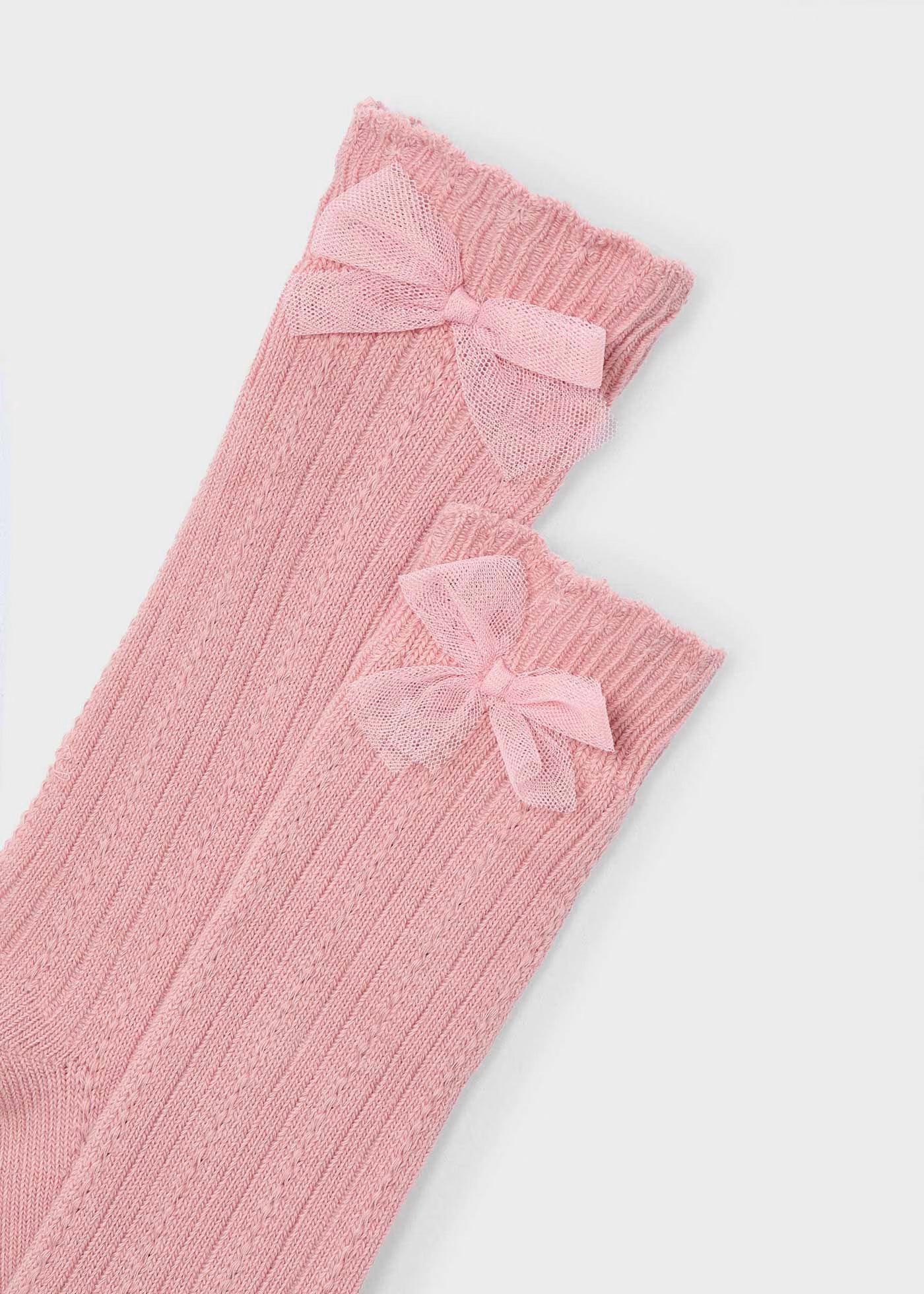 Calceta alta rosa con moño mini niña