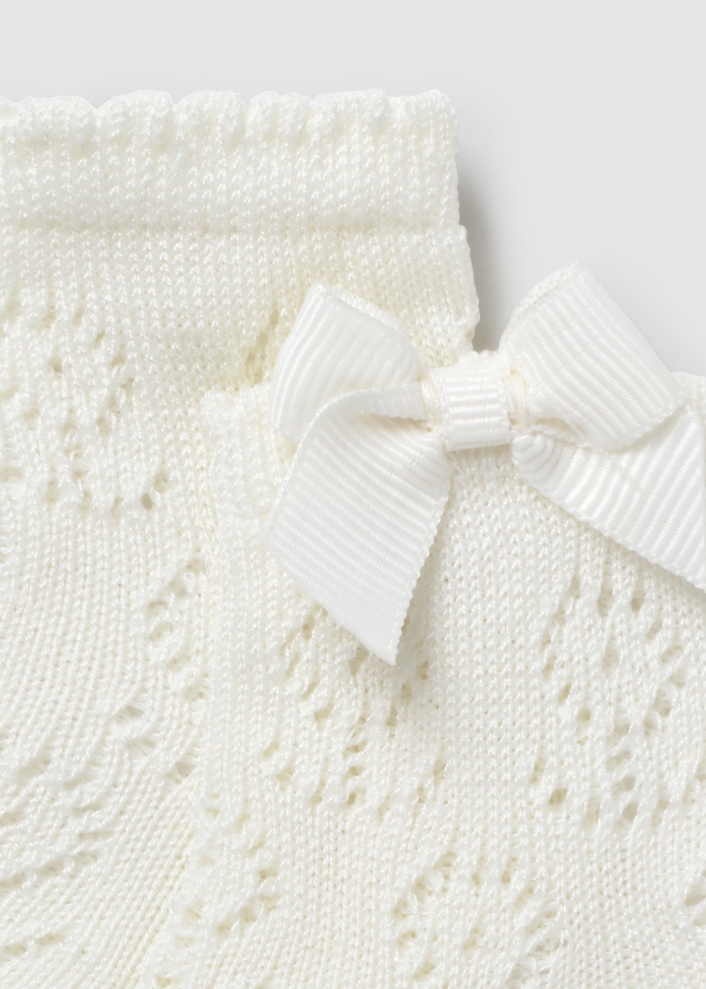 Calcetin calado hueso recién nacida