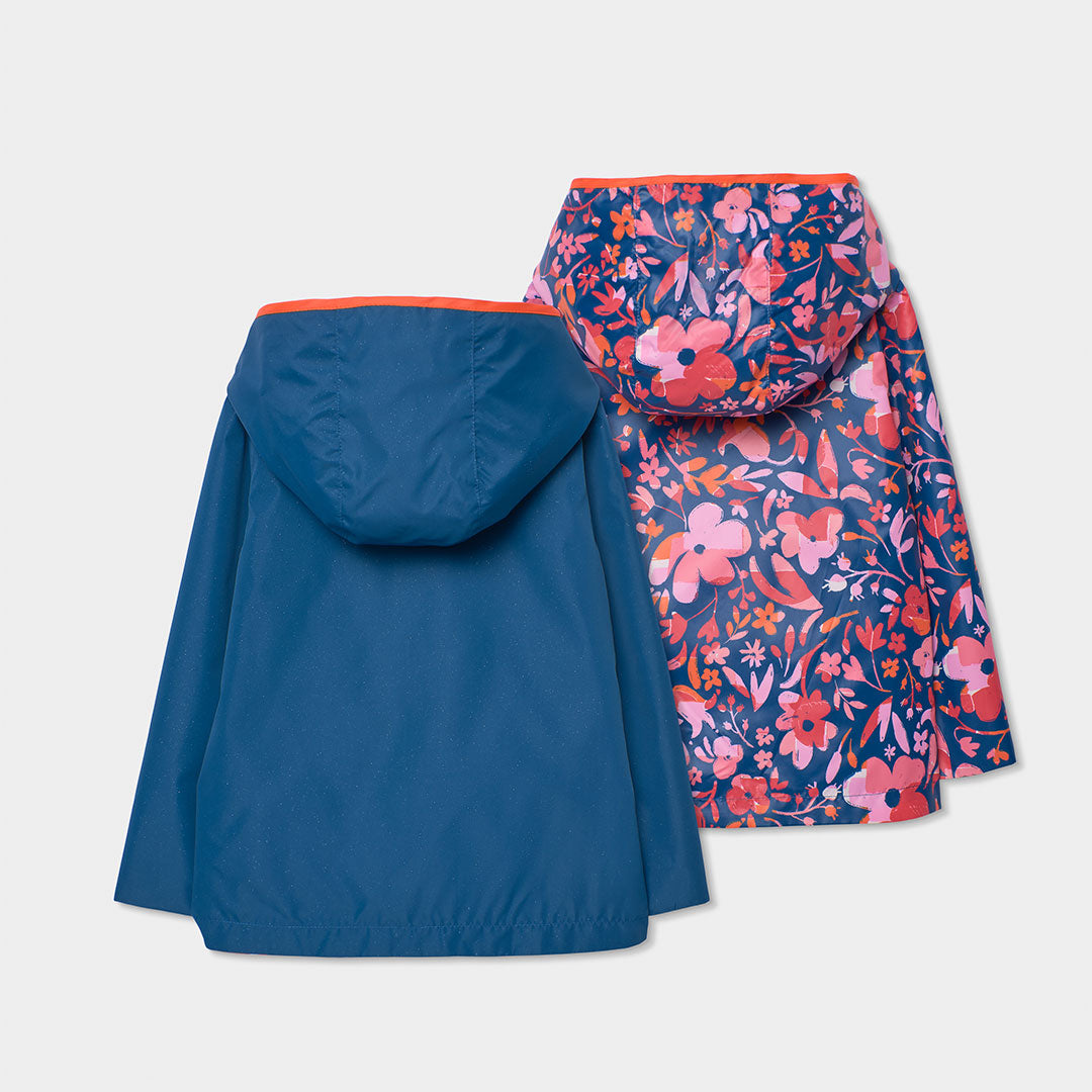 Impermeable reversible azul marino flores mini niña