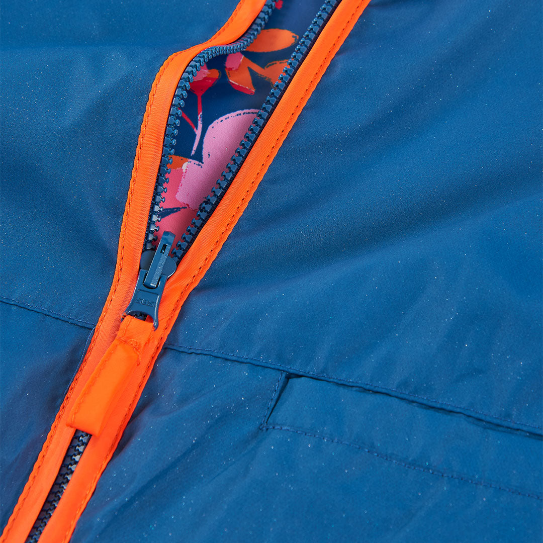 Impermeable reversible azul marino flores mini niña
