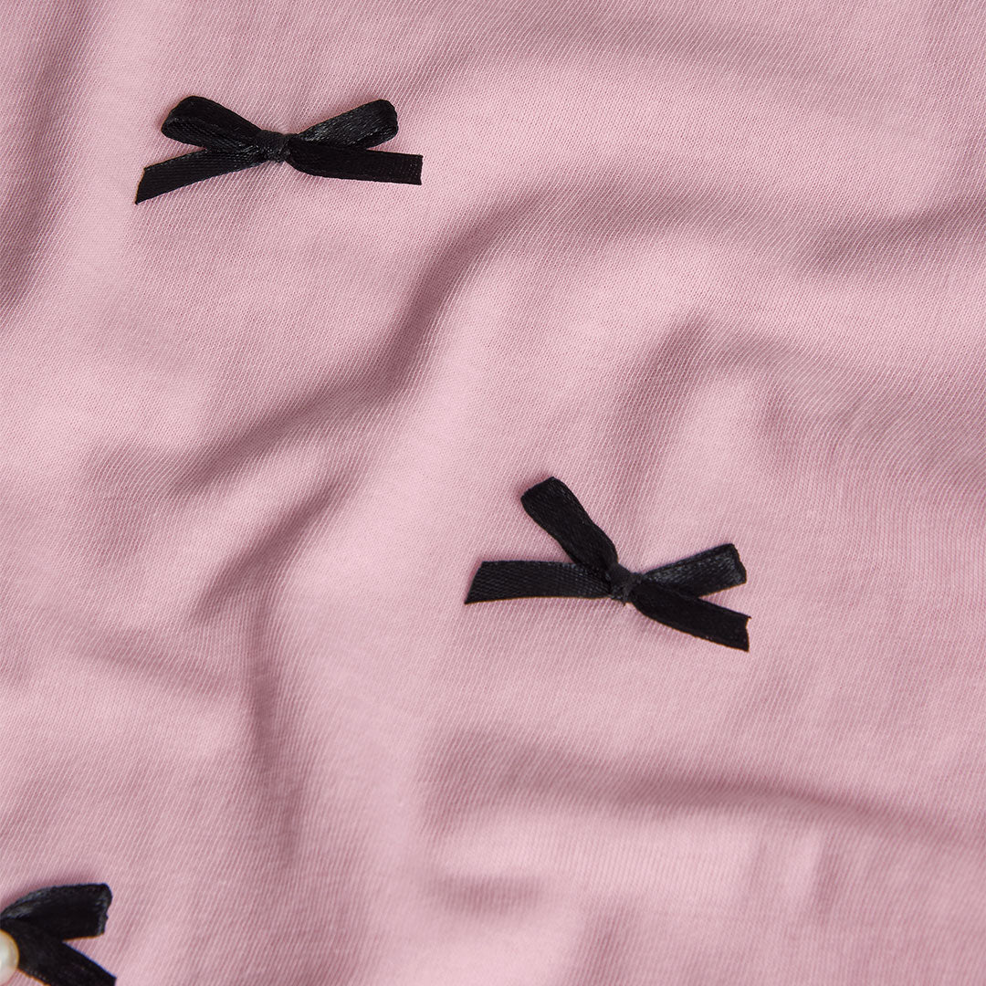 Blusa rosa con moñitos niña jr