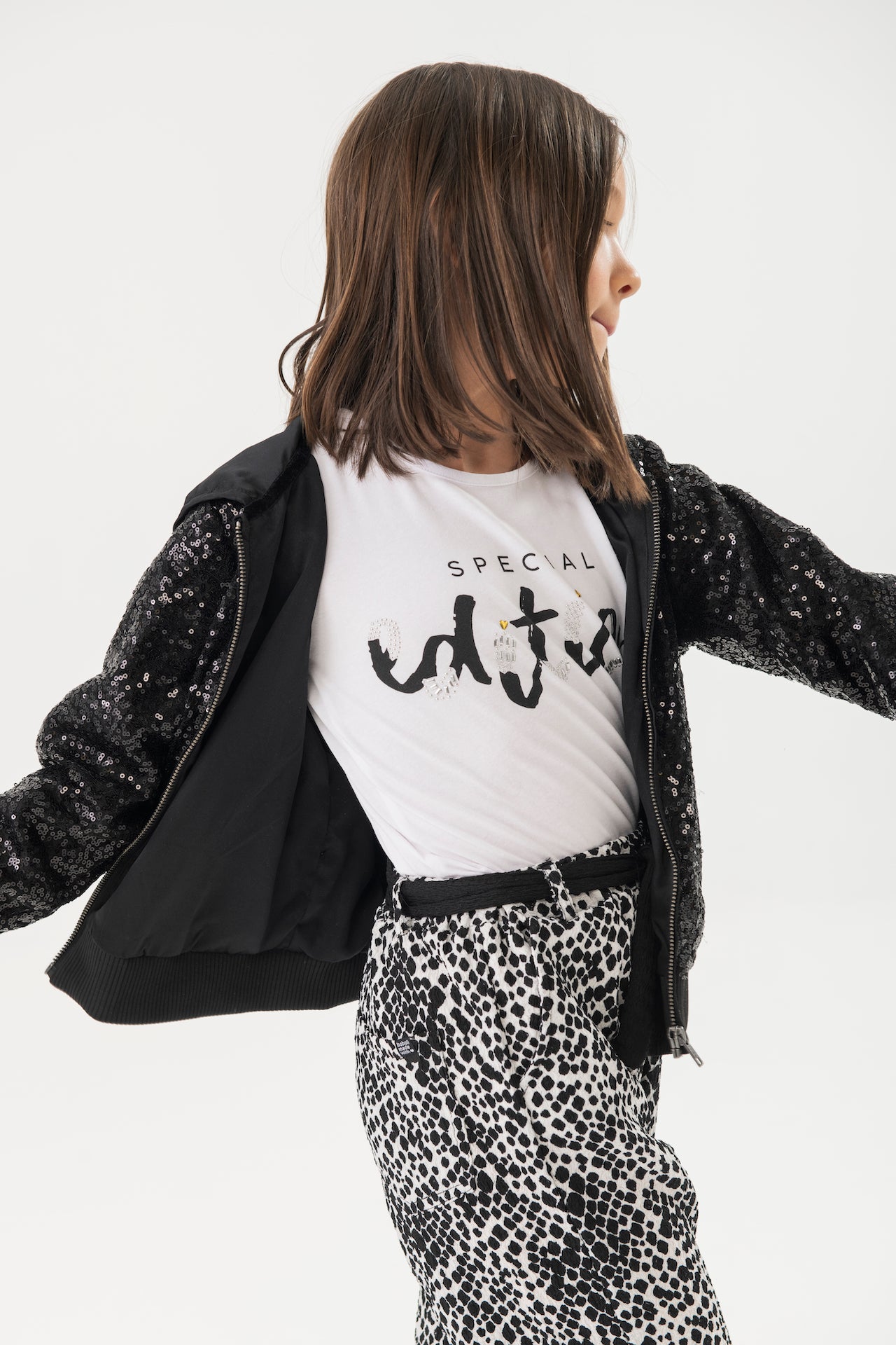 Sudadera negra con lentejuelas para niña jr