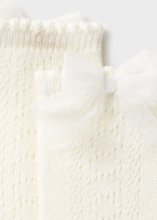 Calceta moño crudo bebé niña