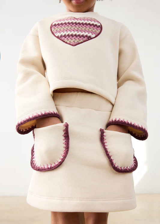Conjunto falda felpa hueso mini niña