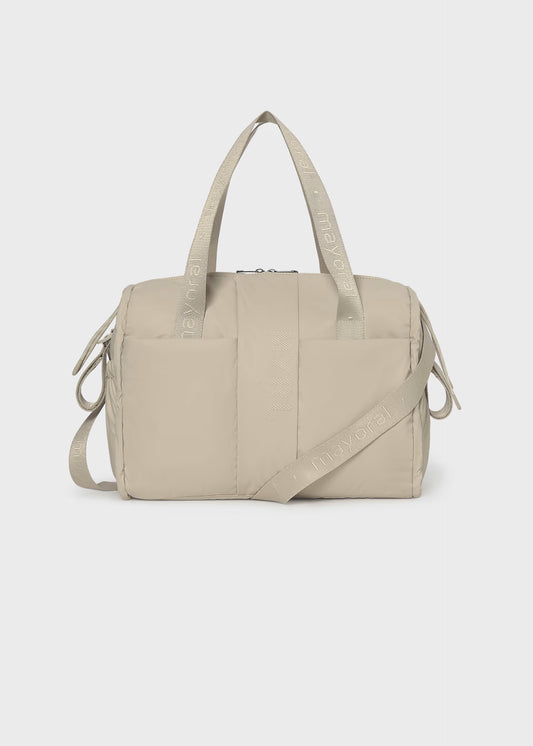 Bolso pañalera impermeable beige recién nacido