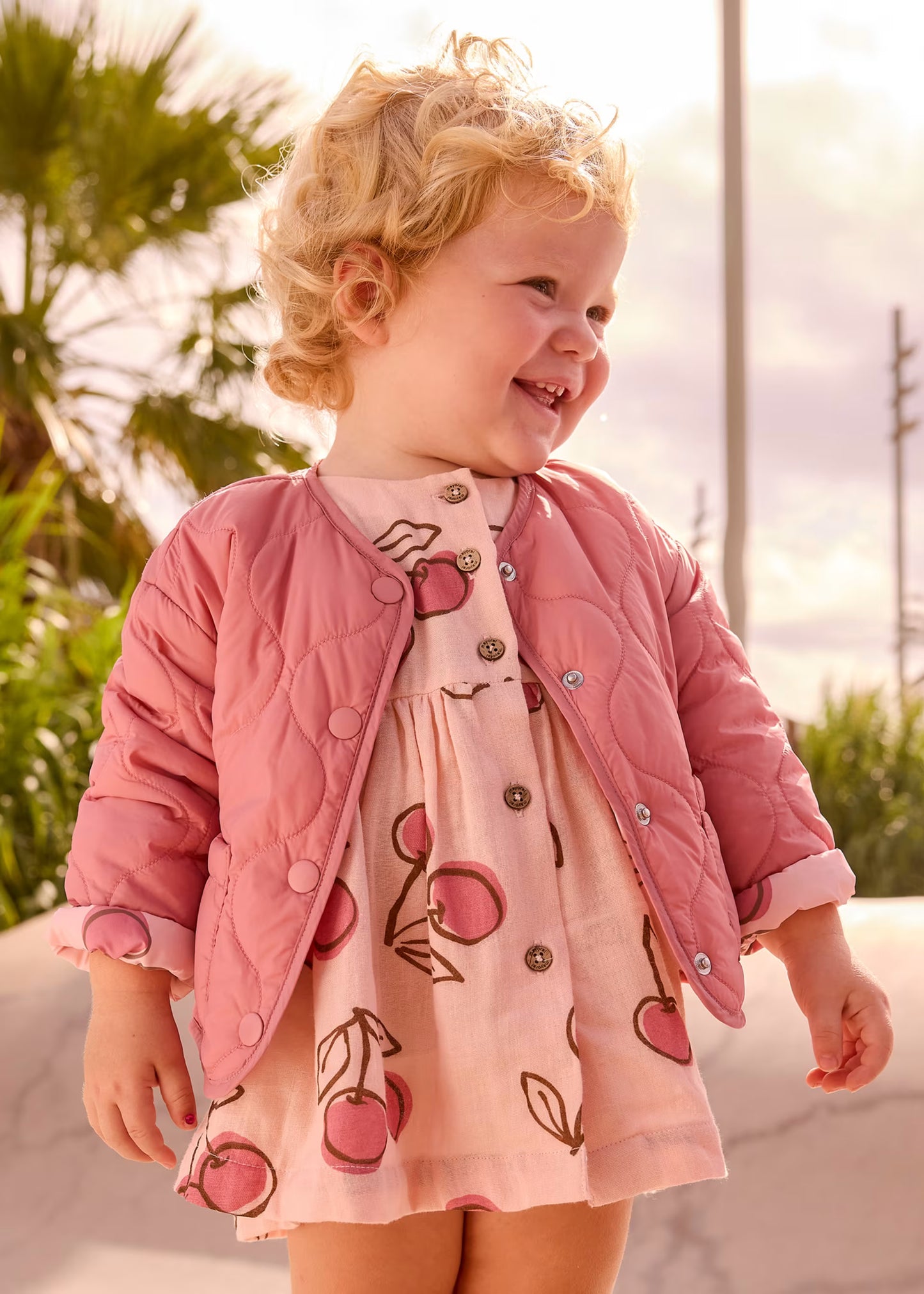 Impermeable acolchado rosa reversible bebé niña