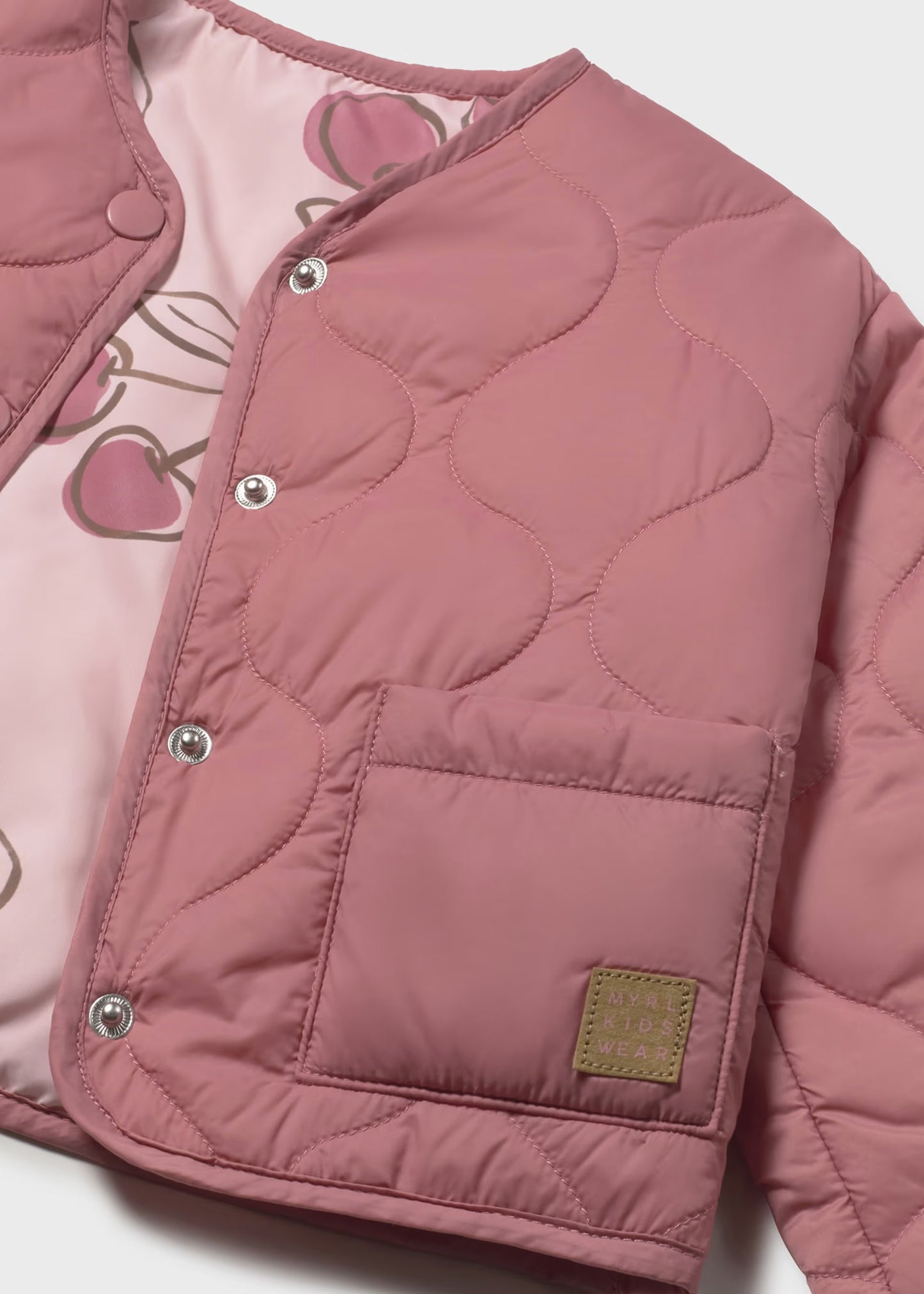 Impermeable acolchado rosa reversible bebé niña