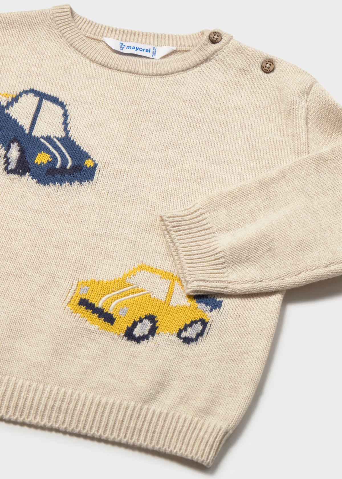 Suéter beige carritos bebé niño