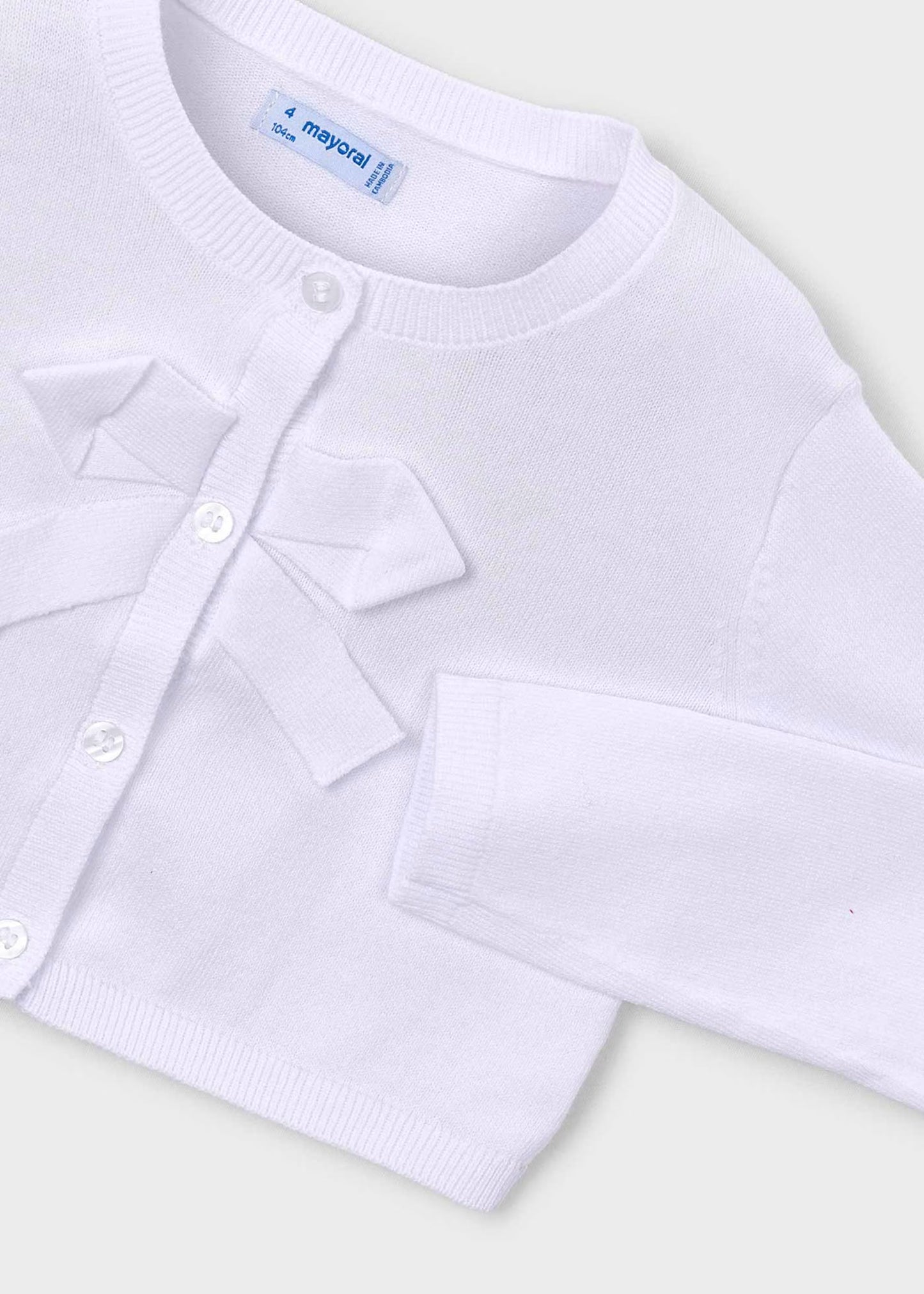 Suéter torera blanca con moño para mini niña